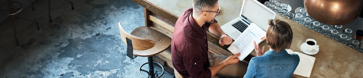 Two business people meeting over coffee