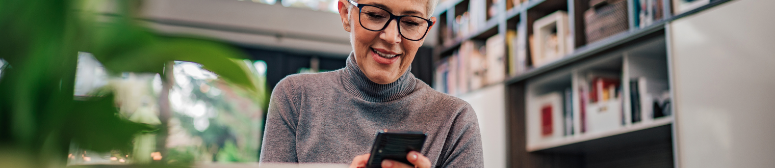 Senior woman banking on mobile app